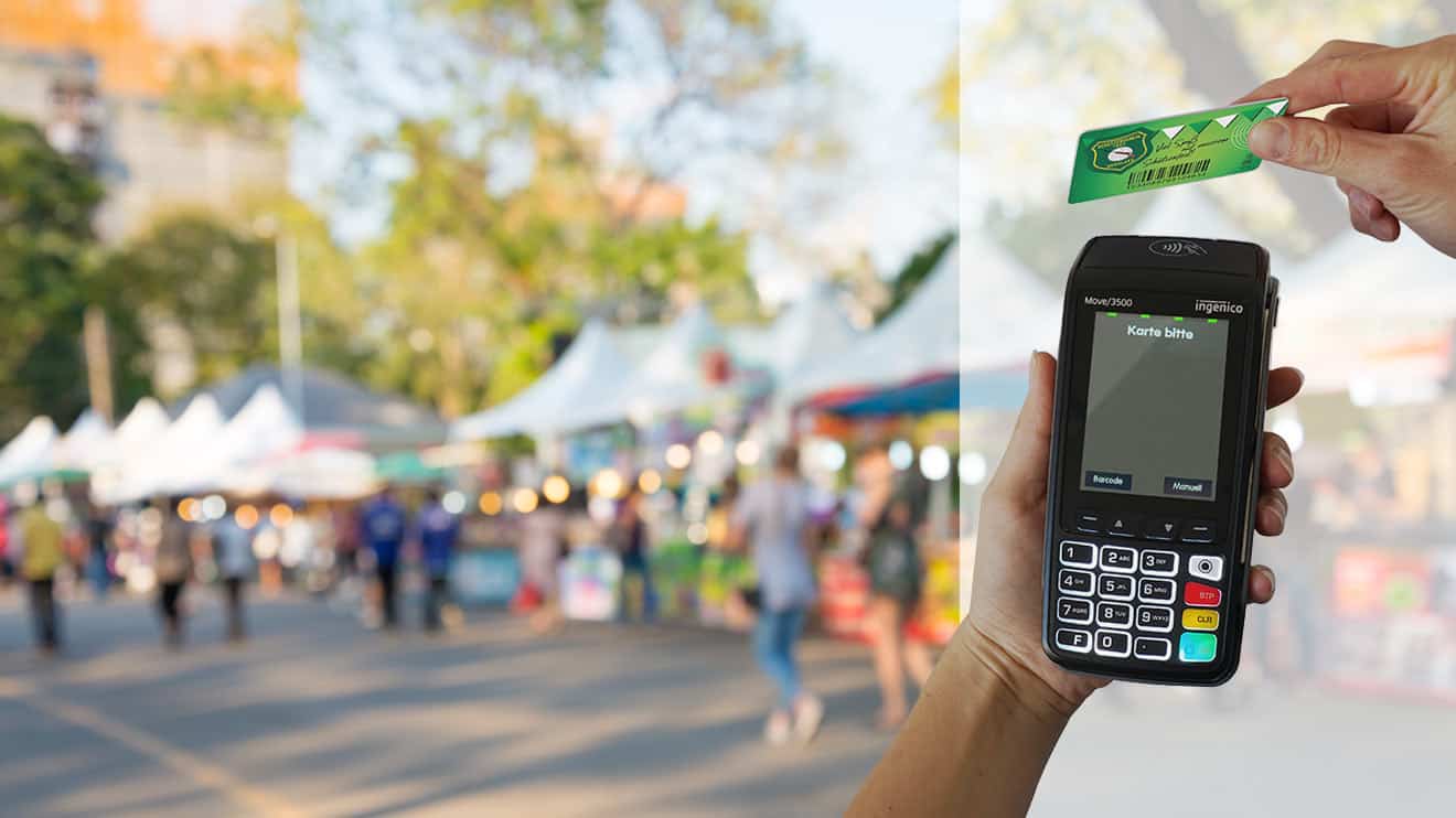 Unscharfes Bild einer Veranstaltung und Bezahlen am Kartenlesegerät mit einer Prepaidkarte